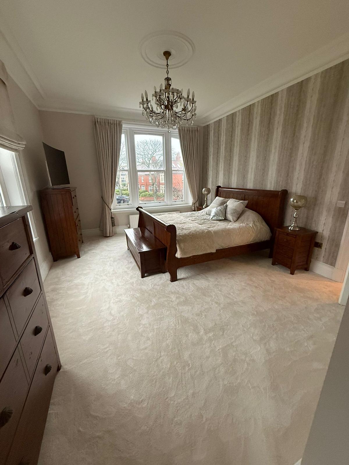 A room with newly fitted flooring by Astoria Carpets